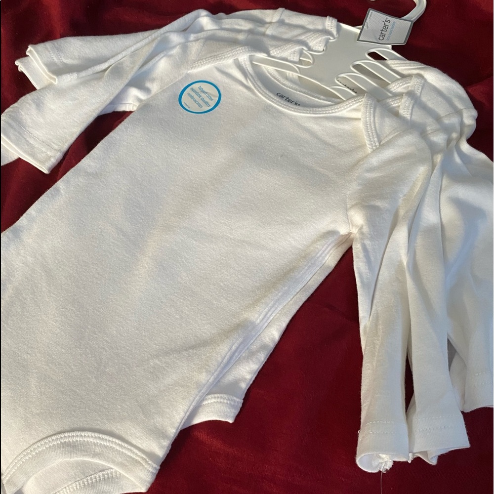 Brand new Carter’s long sleeve onesies